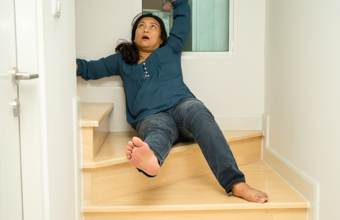 woman falling down the stairs